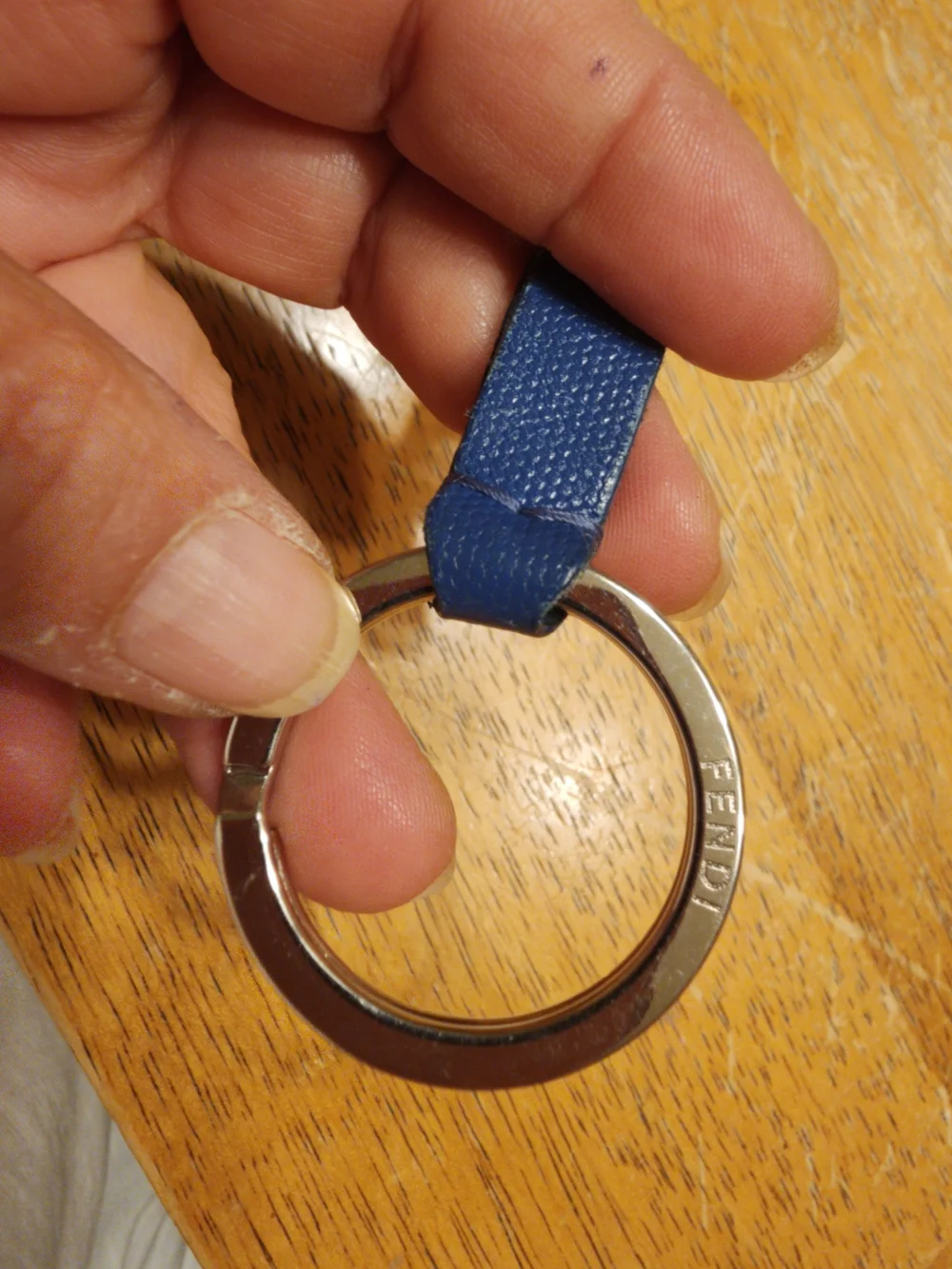 blue leather Fendi logo plaque keychain features silver-tone hardware